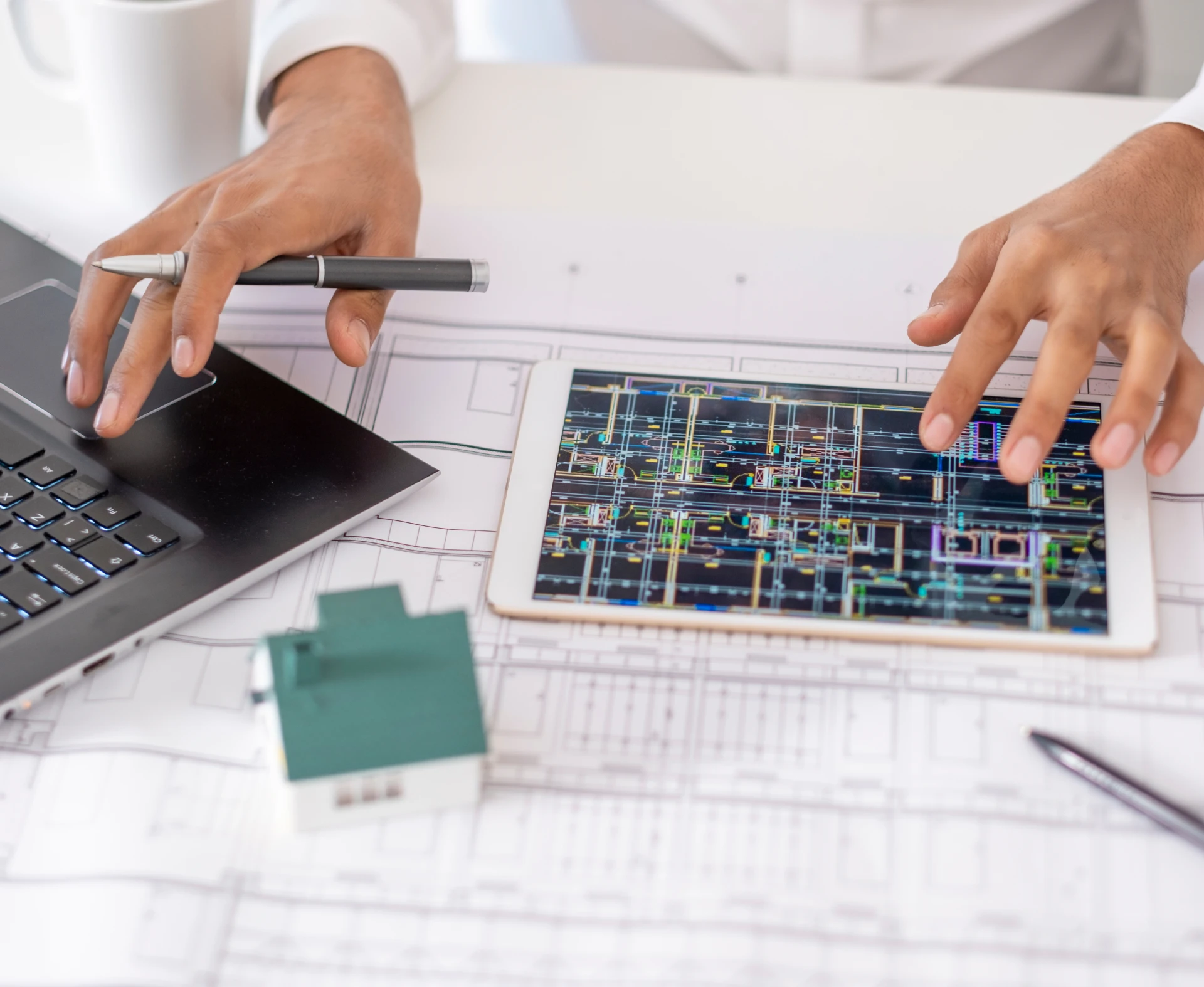 Engineer analyzing building plans on tablet